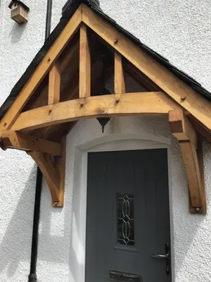 a wooden roof over the door of a house at Tastefully Renovated Cottage in Ulverston in Ulverston