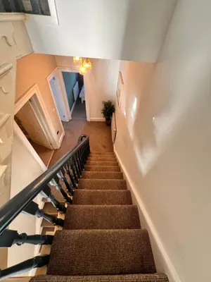 a staircase in a house with a stair case at Casa del Mare-Beachfront House in Morecambe