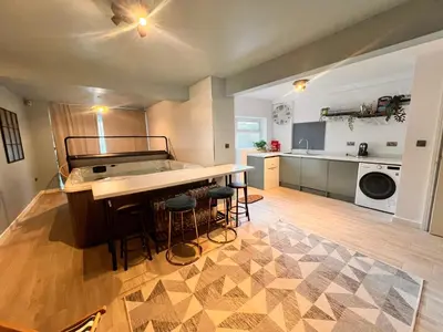 a large kitchen with a large island in a room at Casa del Mare-Beachfront House in Morecambe