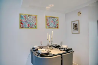 a room with a table with candles on it at Premium Central Liverpool Apartment in Liverpool