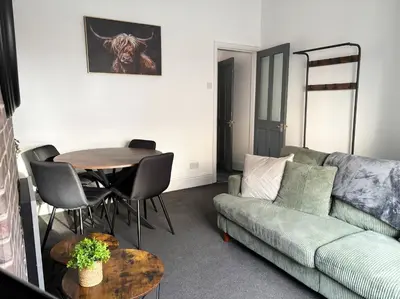 a living room with a couch and a table at Farm Street House by Sapphire Properties -Near to BAE Systems in Barrow