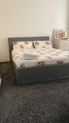 a bed in a room with at My House in Bolton