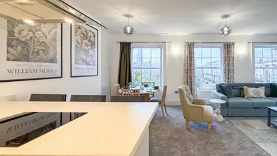 a living room with a couch and a table at Hamilton Square Gardens Apartments by Rework Accommodation in Birkenhead