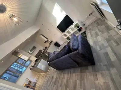 an overhead view of a living room with a couch at Modern Central Flat - Business and Leisure Stays in Preston