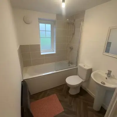 a bathroom with a toilet and a sink at Modern One Bedroom Flat near Anfield Stadium with Parking in Liverpool