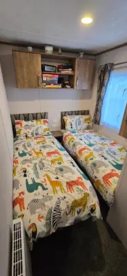 a bedroom with two beds in a room at CJ's Happy Place in Heysham