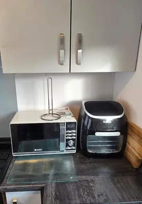 a kitchen with a microwave and a toaster oven at CJ's Happy Place in Heysham