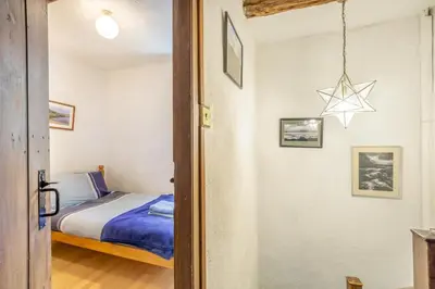 a small bedroom with a bed and a star on the wall at 2 Bed in Lindale oc-c34128 in Lindale