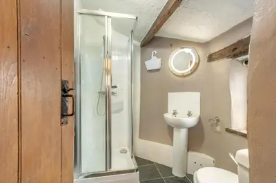 a bathroom with a shower and a toilet and a sink at 2 Bed in Lindale oc-c34128 in Lindale