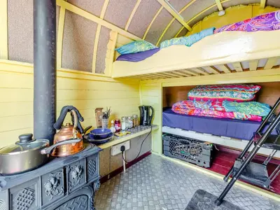 a kitchen with a stove and a bunk bed at Harans Vardo - Uk42959 in Altham