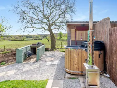 a backyard with a grill and a fence at Harans Vardo - Uk42959 in Altham