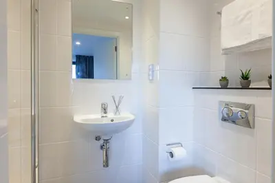 a white bathroom with a sink and a toilet at For Students Only - True Liverpool in Liverpool