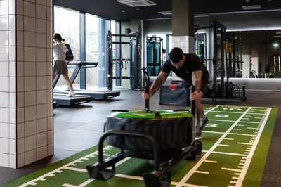 a man pushing a luggage cart in a gym at For Students Only - True Liverpool in Liverpool