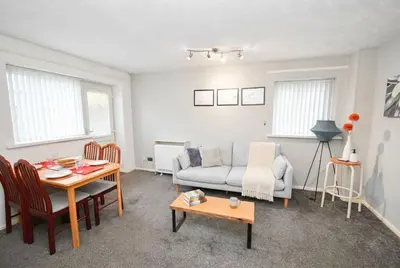 a living room with a couch and a table at Convenient 2 Bedroom Apartment in Preston w WiFi in Preston