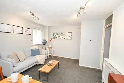 a living room with a couch and a table at Convenient 2 Bedroom Apartment in Preston w WiFi in Preston