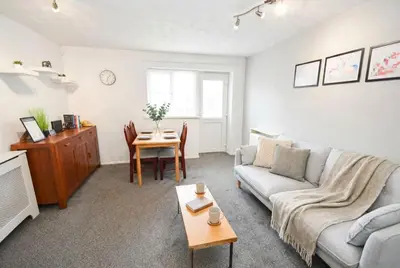 a living room with a couch and a table at Convenient 2 Bedroom Apartment in Preston w WiFi in Preston
