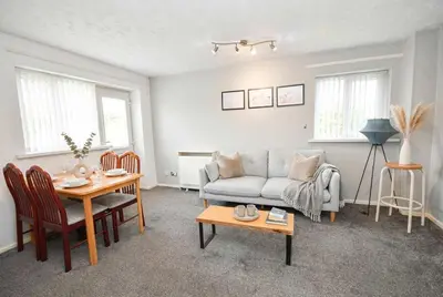 a living room with a couch and a table at Convenient 2 Bedroom Apartment in Preston w WiFi in Preston