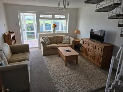 a living room with a couch and a tv at Peplow Place, A Great Two Bedroom Retreat in Heysham