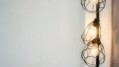 a cluster of lights hanging on a wall at Modern 2BR Near Liverpool ONE & Parking in Liverpool