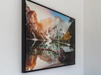 a framed picture of a mountain lake and a house at Luxury 3-Bedroom, 3-Bath Home in Dalton-in-Furness in Dalton in Furness