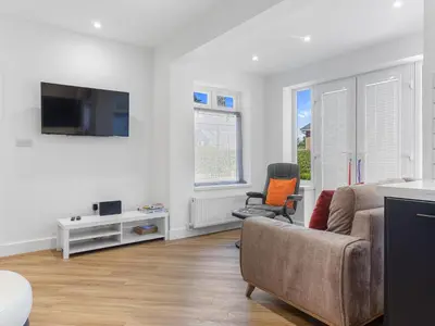 a living room with a couch and a chair at Luxury 3-Bedroom, 3-Bath Home in Dalton-in-Furness in Dalton in Furness
