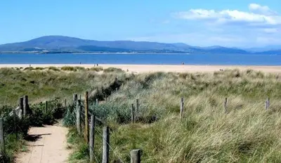 a path leading to a beach with a fence at Mount Pleasant Town House Gem in Barrow