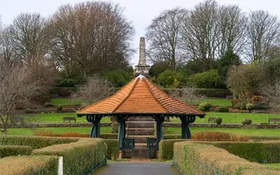 a gazebo in the middle of a garden at Mount Pleasant Town House Gem in Barrow