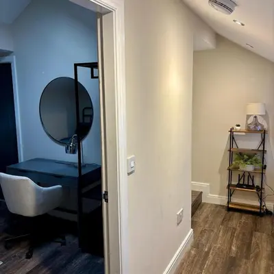 a bathroom with a mirror and a sink and a mirror at Cosy Parbold Apartment Steps form train station in Parbold