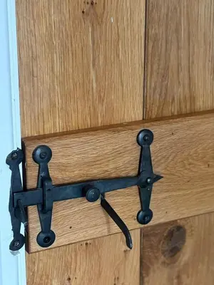 a black metal latch on a wooden door at Couples - Retreat Dog Friendly in Appley Bridge