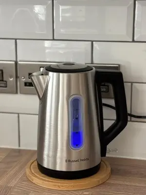 a kettle with a blue top sitting on a counter at Couples - Retreat Dog Friendly in Appley Bridge