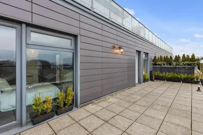 a patio with plants on the side of a building at Skyline Penthouse- Views, Games 2 Parking Spaces in Liverpool