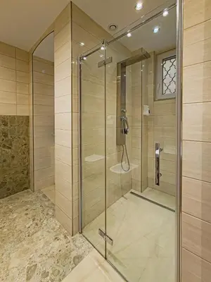a shower with a glass door in a bathroom at Apartment Wilkinson in Liverpool
