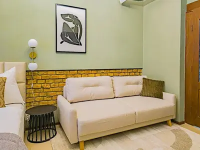 a living room with a couch and a table at Apartment Wilkinson in Liverpool