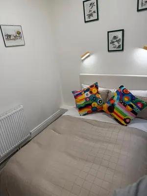 a bed with two pillows on it in a room at Ince House in Liverpool