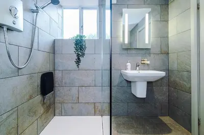 a bathroom with a sink and a mirror at Slyne Lodge in Hest Bank