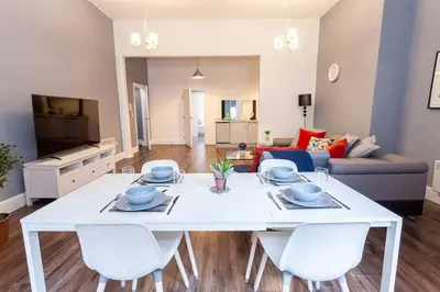 a white table and chairs in a living room at Spacious 2BR -Liverpool Central - Walk to Royal Dock, Nightlife Train Station in Liverpool
