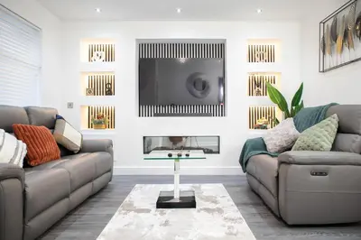 a living room with two couches and a tv at Luxury Preston Home 3 Beds Sleeps 6 in Preston