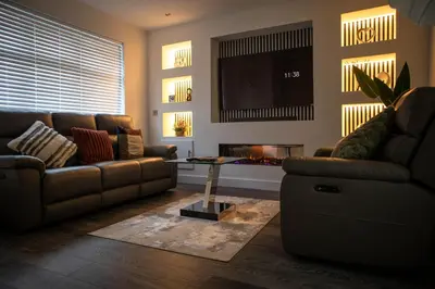 a living room with a couch and a tv at Luxury Preston Home 3 Beds Sleeps 6 in Preston