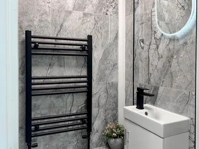 a bathroom with a sink and a mirror at Luxury Preston Home 3 Beds Sleeps 6 in Preston