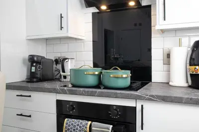 two pots sitting on top of a stove in a kitchen at Luxury Preston Home 3 Beds Sleeps 6 in Preston