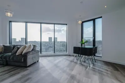 a living room with a couch and a table at Luxurious 2Bed Apartment, Sleeps 6, 3 beds in Preston