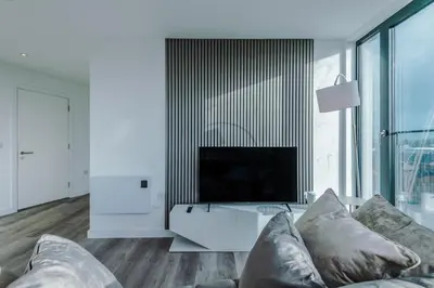 a living room with a couch and a tv at Luxurious 2Bed Apartment, Sleeps 6, 3 beds in Preston