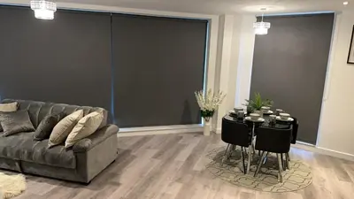 a living room with a couch and a table at Luxurious 2Bed Apartment, Sleeps 6, 3 beds in Preston