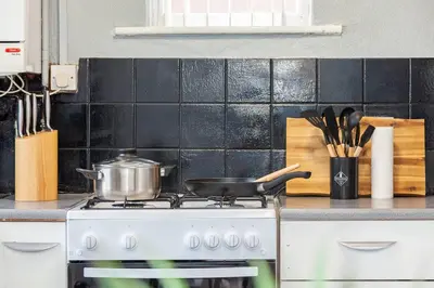 a pot on a stove in a kitchen at Close to City Centre - Mins Away from Anfield Stadium - Free Street Parking in Liverpool