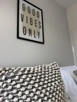 a bedroom with a bed and a picture on the wall at Month Stays Central 3 bed Three Bedroom House by Brookland Stays Serviced Accommodation & Short Lets in Preston with Free WiFi in Farington