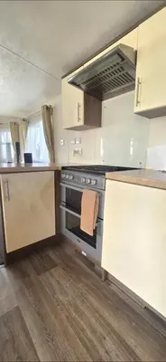 a kitchen with an oven with a towel on the stove at BILOT Caravan in Heysham