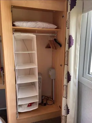 a bunk bed in a room with a closet at Seaside Arizona in Morecambe