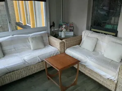 a living room with two couches and a coffee table at King Edward Guesthouse in Blackpool