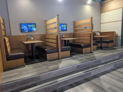 a fast food restaurant with two tables and chairs at T&K's Caravan in Morecambe