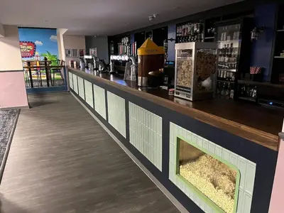 a bar with a fireplace at a restaurant at T&K's Caravan in Morecambe